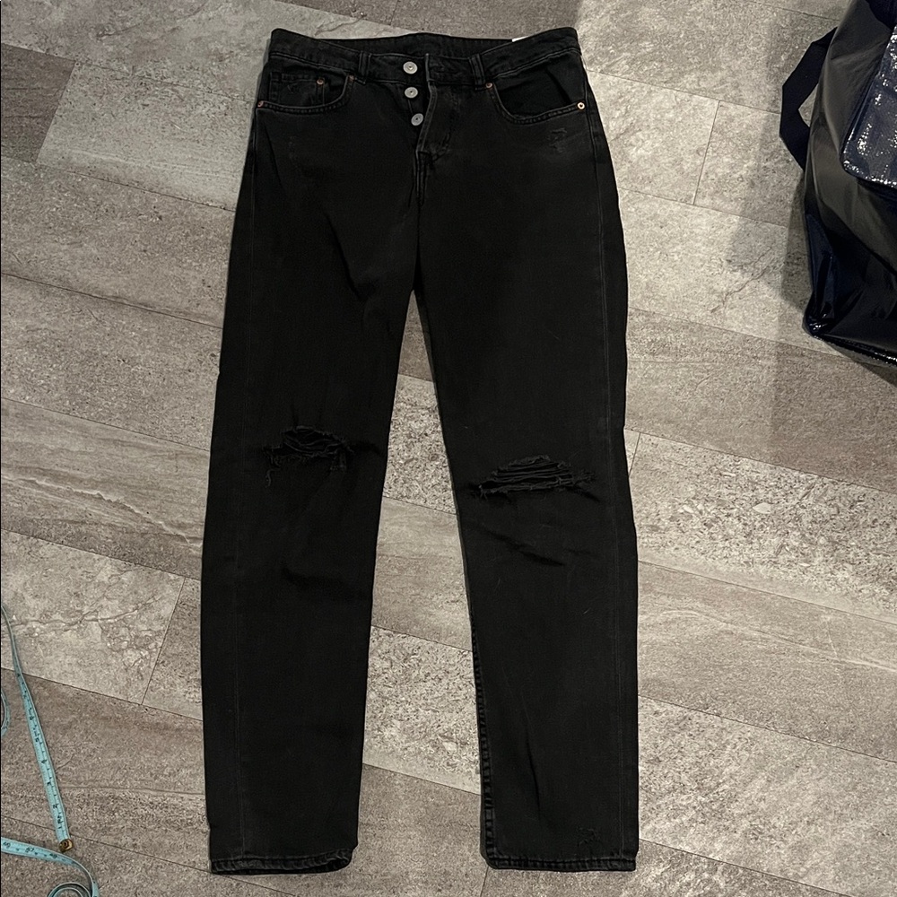 Mid rise black distressed denim jeans